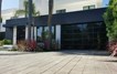 Contemporary Black Aluminum & Black Laminate (Privacy) Glass Garage Door